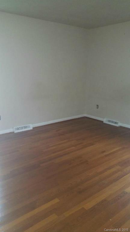6021 Powder Horn Road Charlotte, NC 28212 - Photo 8 of 10 a view of an empty room with wooden floor