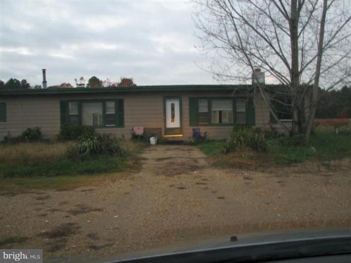 48162 Beachville Road St. Inigoes, MD 20684 - Photo 1 of 1 a front view of a house with garden