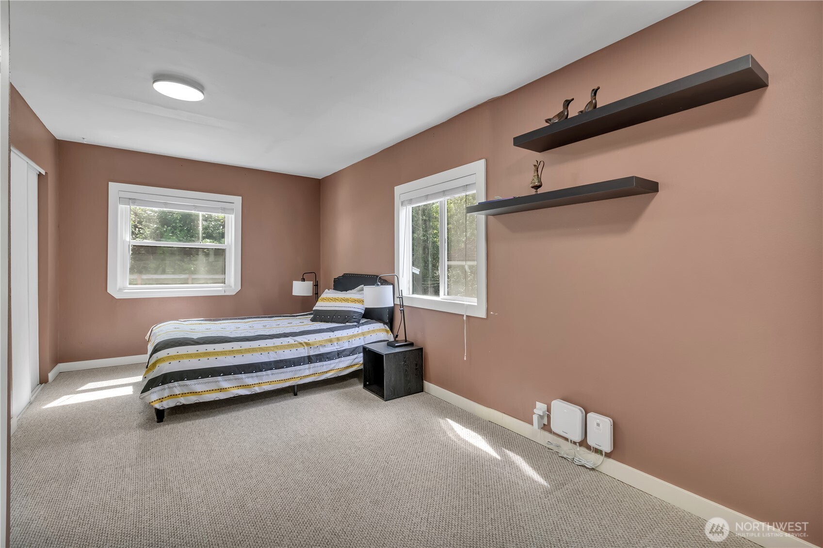 2307 Southwest Myrtle Street Seattle, WA 98106 - Photo 13 of 30 a spacious bedroom with a bed and a window