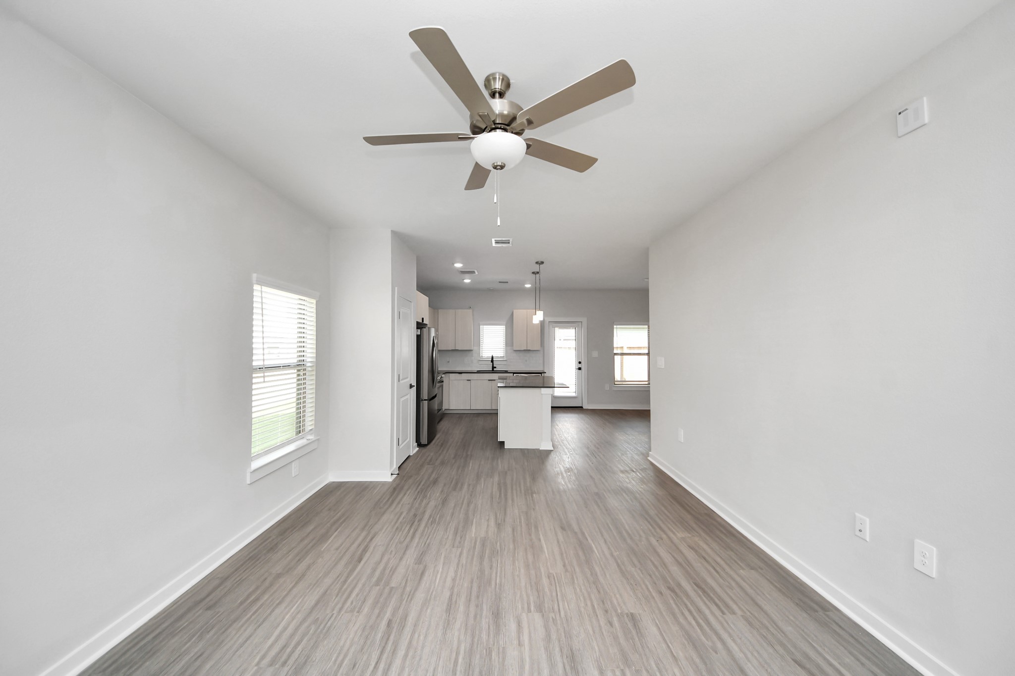7711 Longmire Road, Unit 5 Conroe, TX 77304 - Photo 44 of 48 Open Concept Floor Plan with wood-like floors throughout!