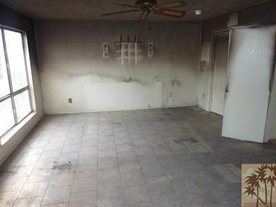 66092 Santa Rosa Road Desert Hot Springs, CA 92240 - Photo 3 of 8 an empty room with windows