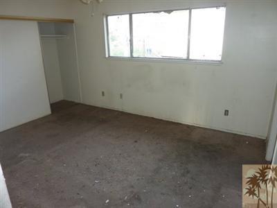 66092 Santa Rosa Road Desert Hot Springs, CA 92240 - Photo 4 of 8 an empty room with a window
