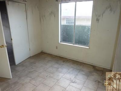66092 Santa Rosa Road Desert Hot Springs, CA 92240 - Photo 6 of 8 a view of an empty room with a window