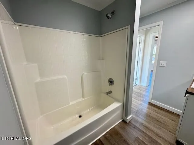a view of kitchen with sink and wooden floor