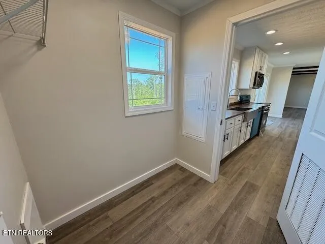 a view of balcony with wooden floor and outdoor space