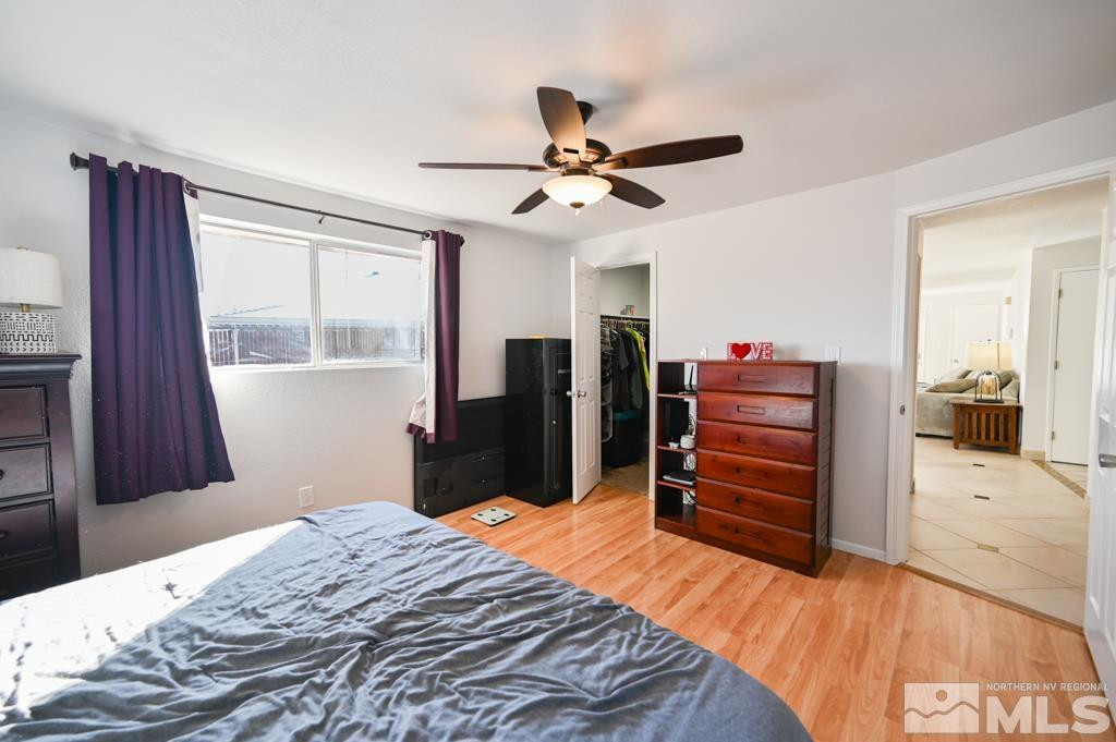 340 West Hampton Drive Carson City, NV 89706 - Photo 18 of 24 a bedroom with a bed and a dresser