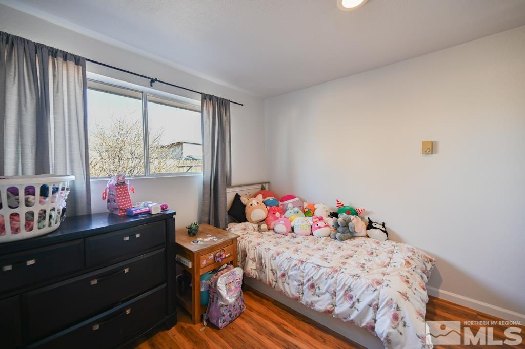 340 West Hampton Drive Carson City, NV 89706 - Photo 20 of 24 a bedroom with a bed and a window