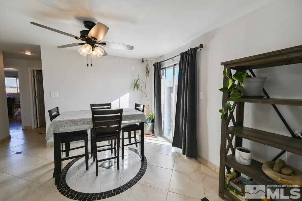 340 West Hampton Drive Carson City, NV 89706 - Photo 10 of 24 a view of a dining room with furniture and a chandelier