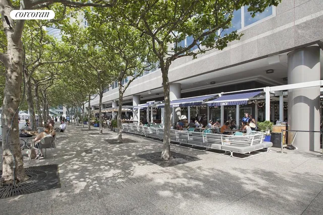 a view of a patio with table and chairs and potted plants