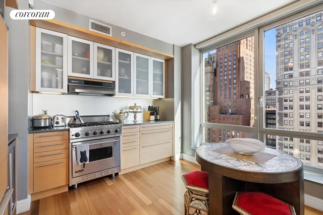 a kitchen with stainless steel appliances granite countertop a stove and a sink
