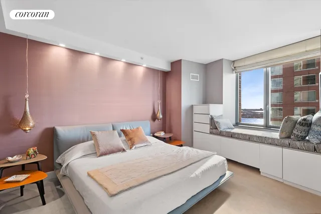 a bedroom with a bed and window