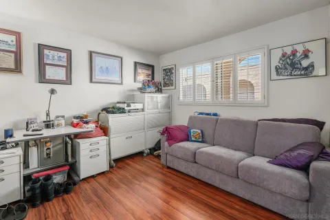 a living room with furniture and flat screen tv