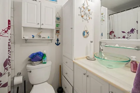 a kitchen with granite countertop a sink and cabinets