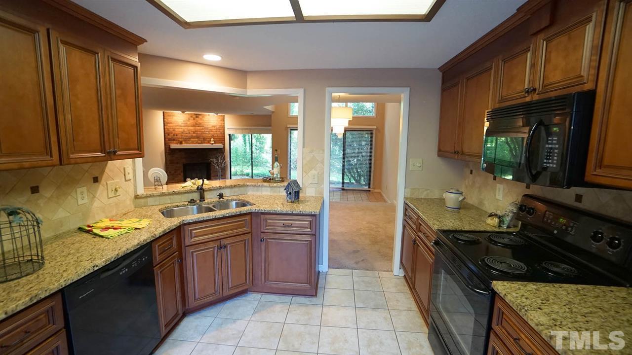 4301 Sun Belt Place Raleigh, NC 27613 - Photo 10 of 23 Updated Kitchen has Granite Countertops and Tile Backsplash