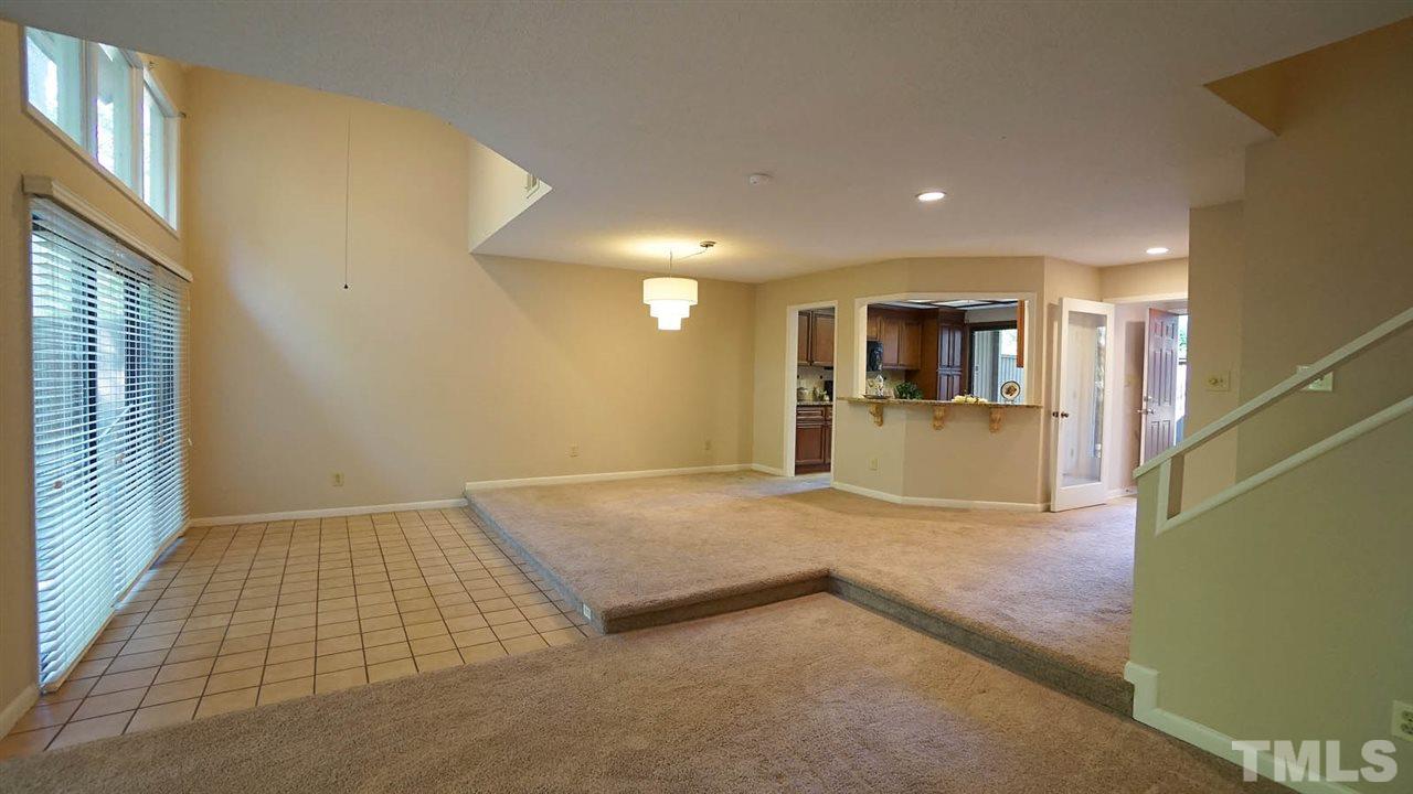 4301 Sun Belt Place Raleigh, NC 27613 - Photo 7 of 23 Sunken Sun Room has Ceramic Flooring + Sliding Glass Doors overlooking Totally Private Backyard.