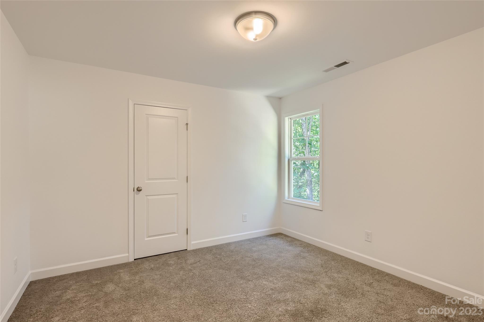626 Colston Street Albemarle, NC 28001 - Photo 9 of 11 an empty room with windows