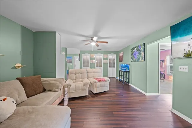 a view of a patio with a table and chairs under an umbrella