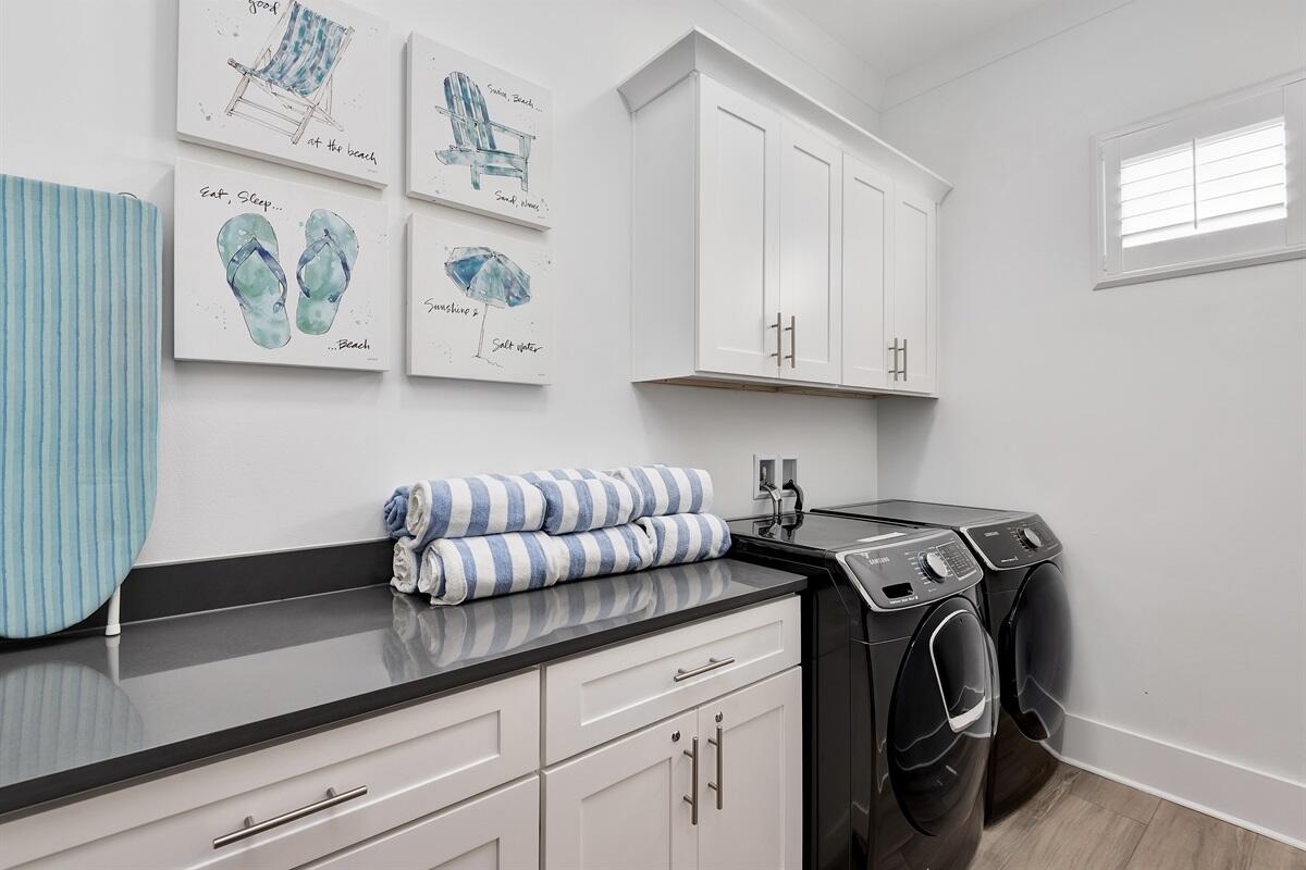 63 Wadleigh Way Miramar Beach, FL 32550 - Photo 11 of 42 a kitchen with stainless steel appliances granite countertop a sink and a wooden floor