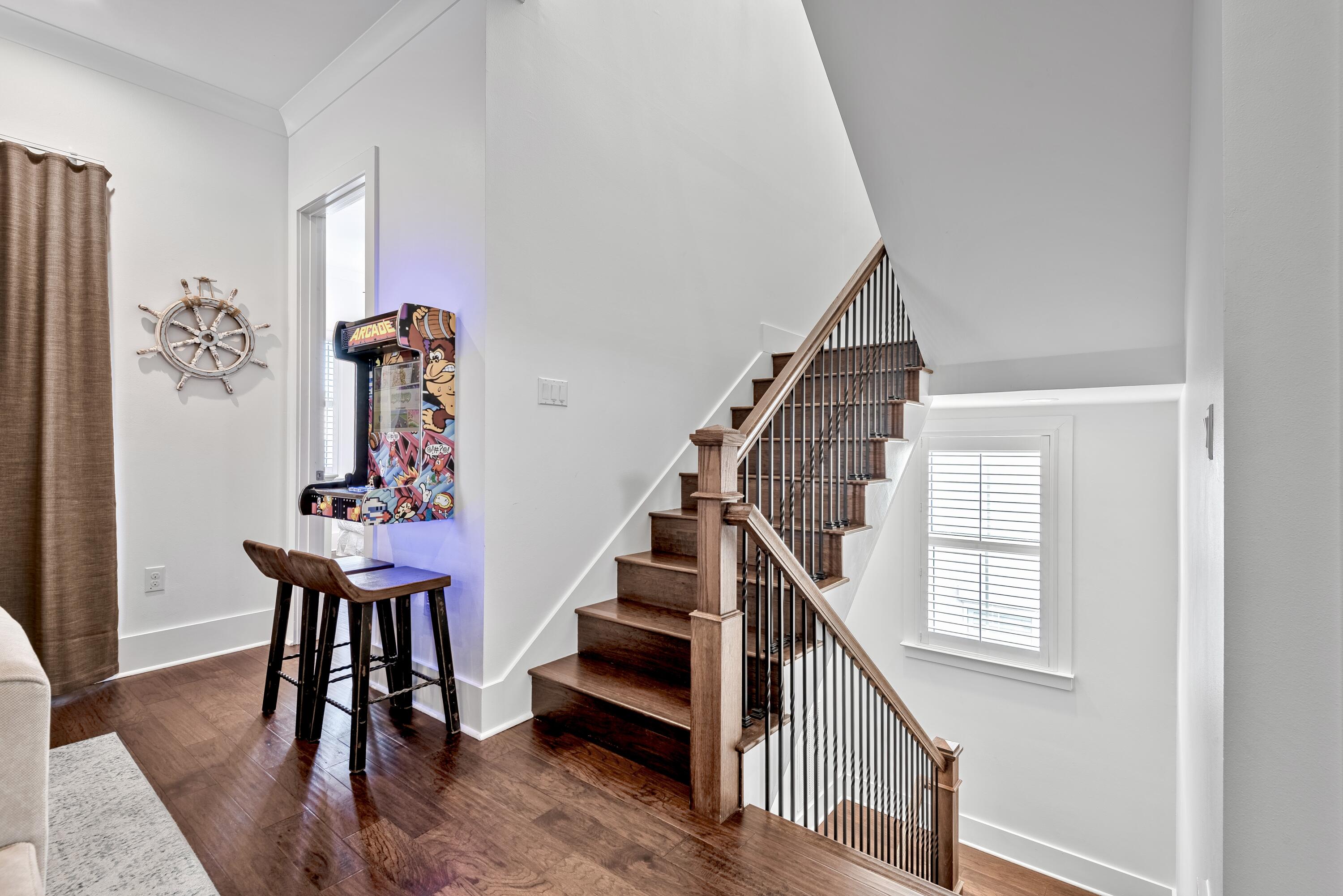 63 Wadleigh Way Miramar Beach, FL 32550 - Photo 18 of 42 a view of entryway with wooden floor and stairs