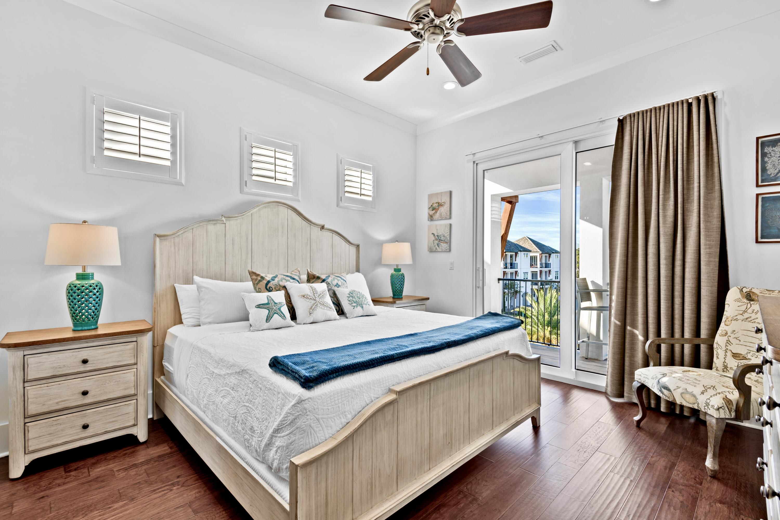 63 Wadleigh Way Miramar Beach, FL 32550 - Photo 24 of 42 a bedroom with a bed and a chandelier