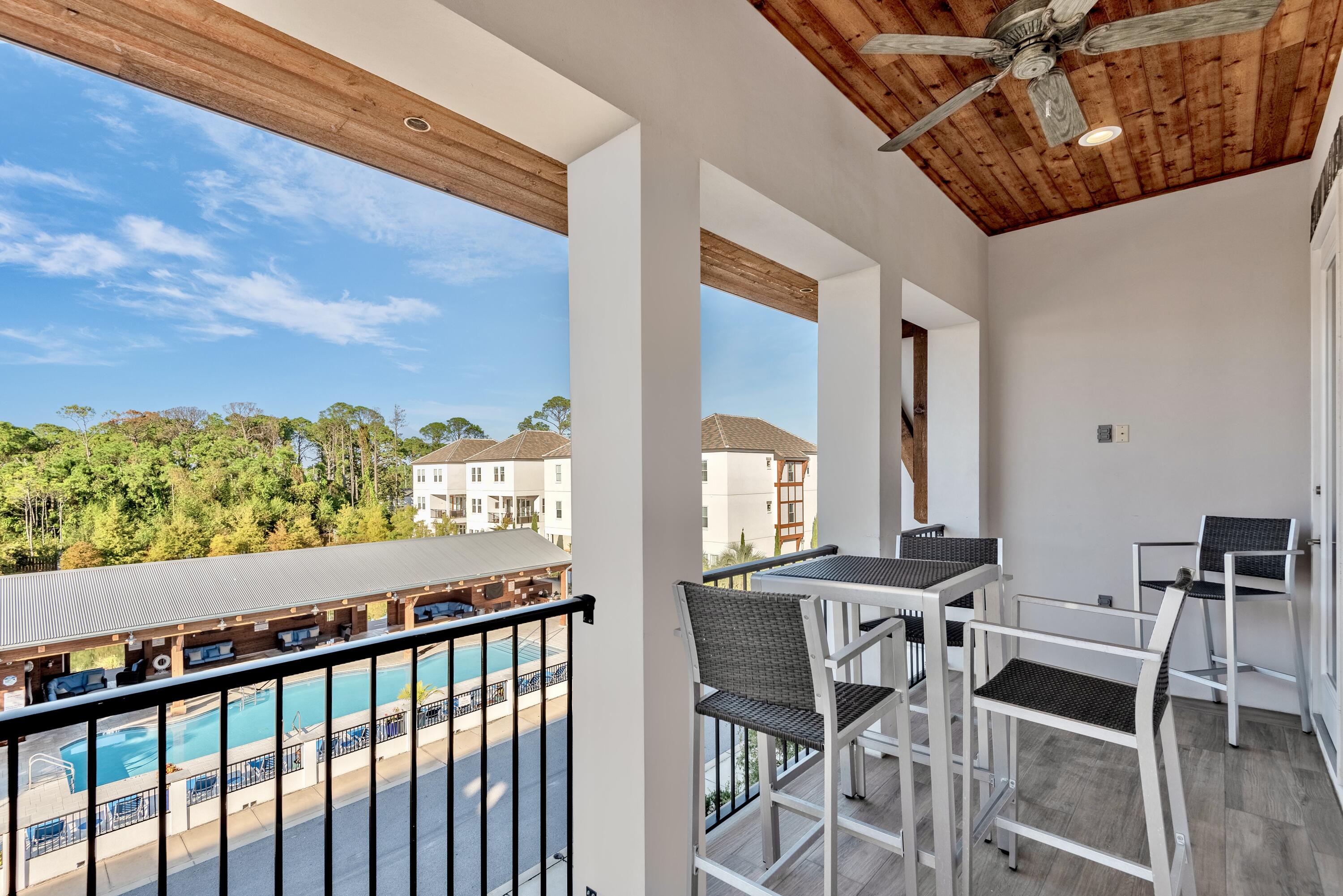 63 Wadleigh Way Miramar Beach, FL 32550 - Photo 25 of 42 a view of a balcony dining table and chairs