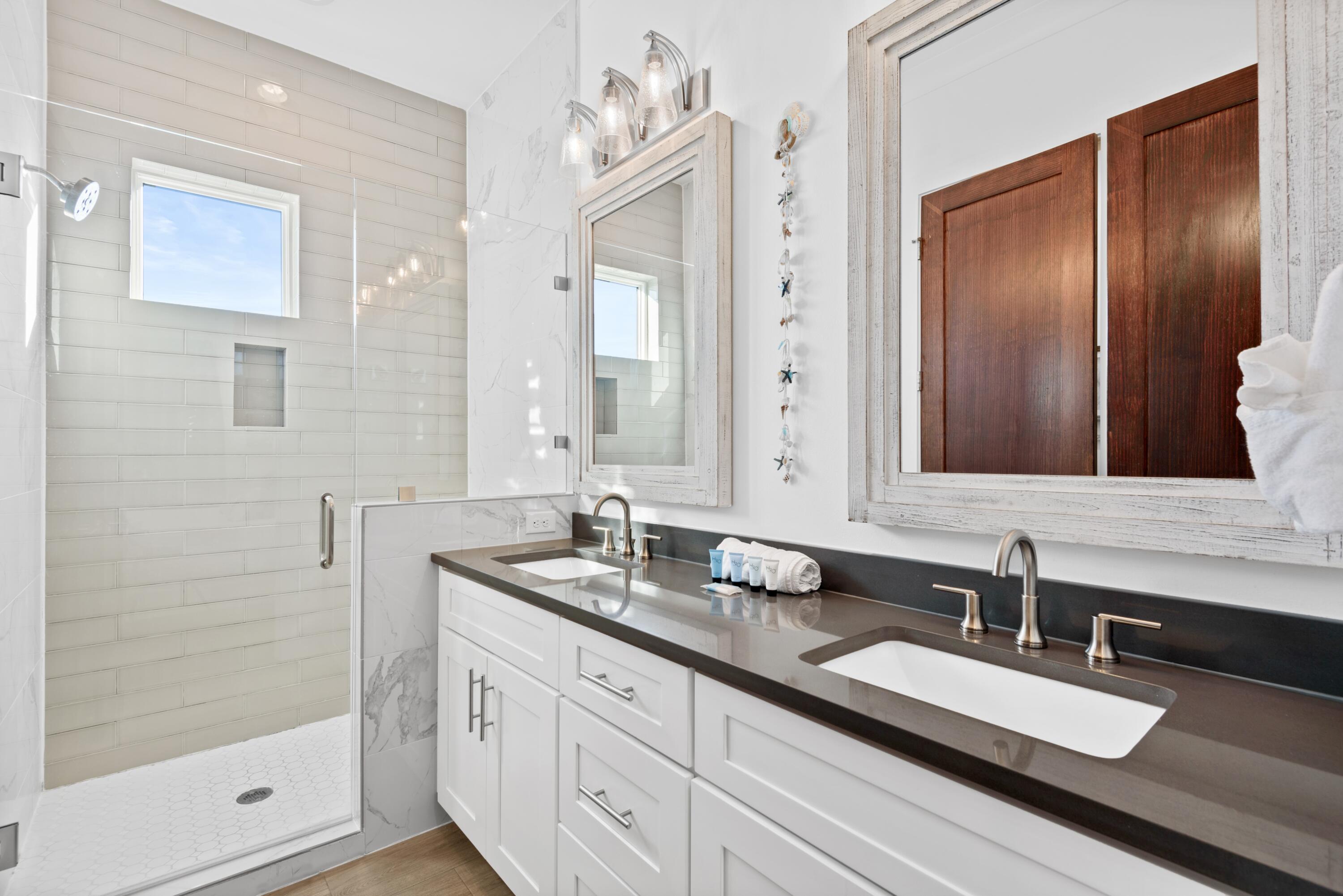 63 Wadleigh Way Miramar Beach, FL 32550 - Photo 26 of 42 a bathroom with a double vanity sink and a mirror