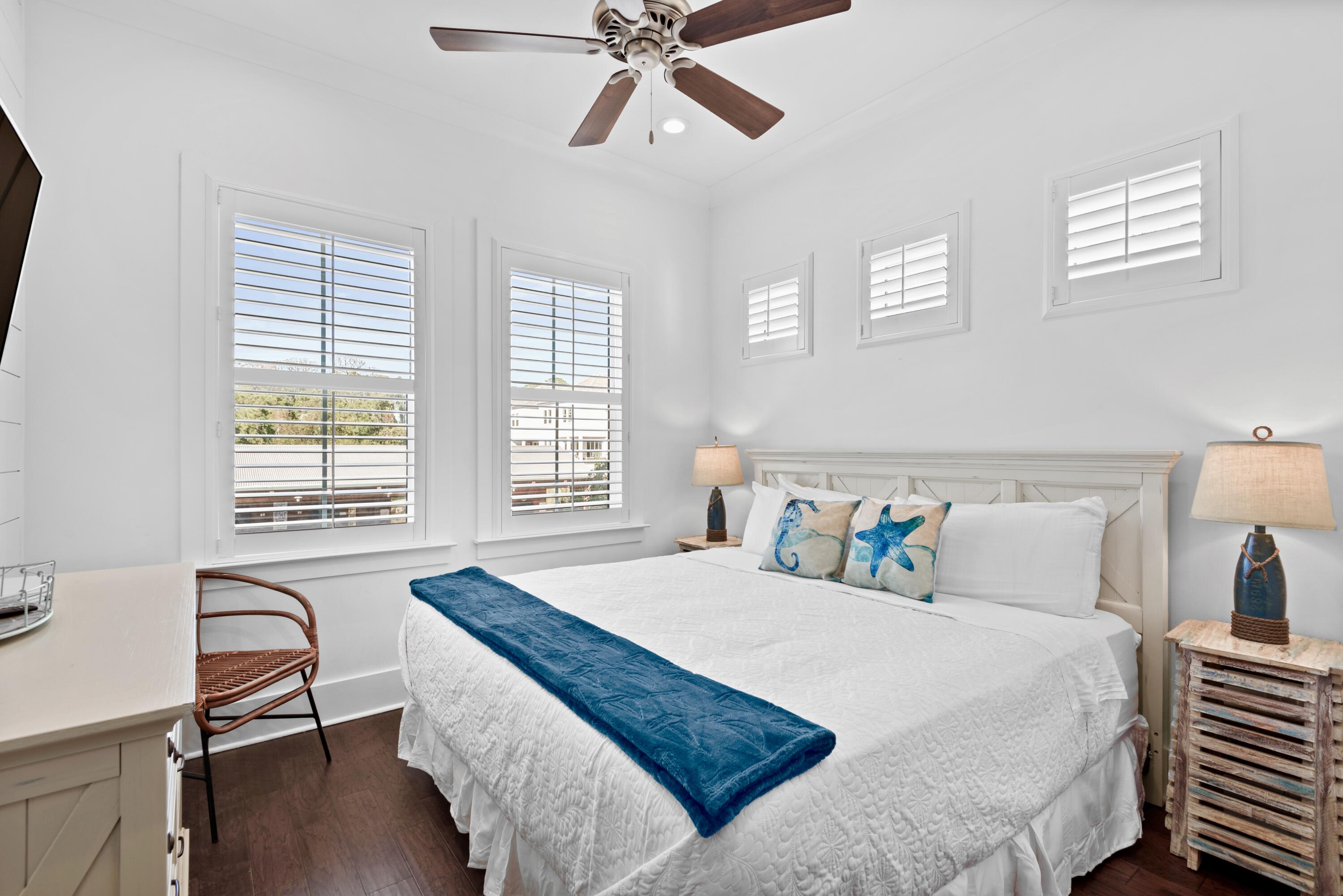 63 Wadleigh Way Miramar Beach, FL 32550 - Photo 28 of 42 a bedroom with a bed and wooden floor