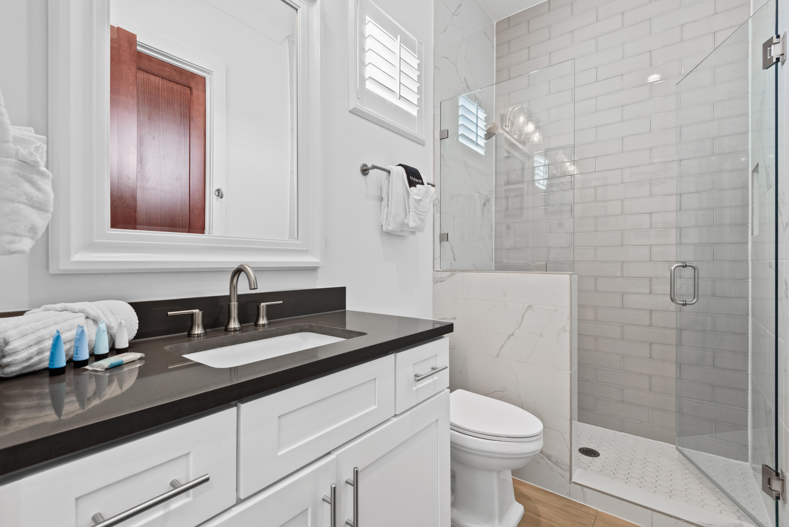 63 Wadleigh Way Miramar Beach, FL 32550 - Photo 30 of 42 a bathroom with a granite countertop sink a toilet and shower