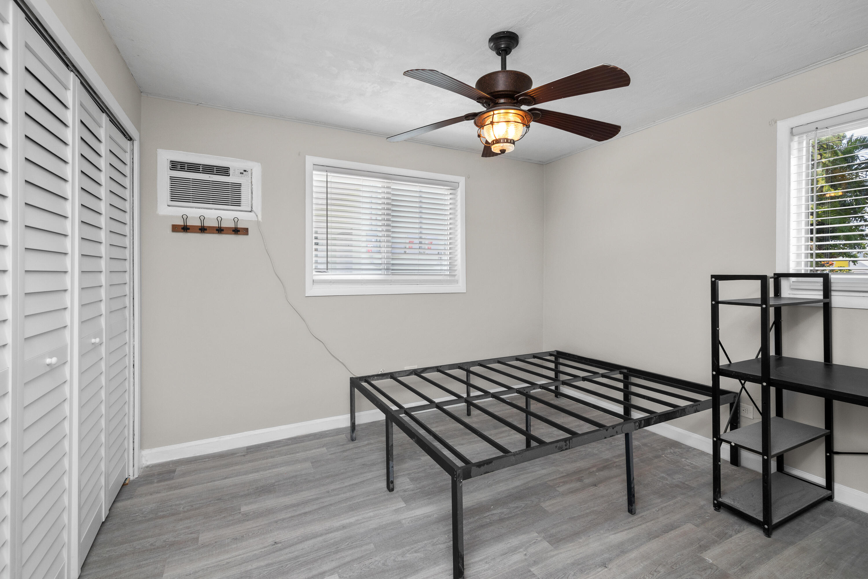 10873 7th Ave Gulf Marathon, FL 33050 - Photo 5 of 25 a view of hallway with wooden floor and a ceiling fan