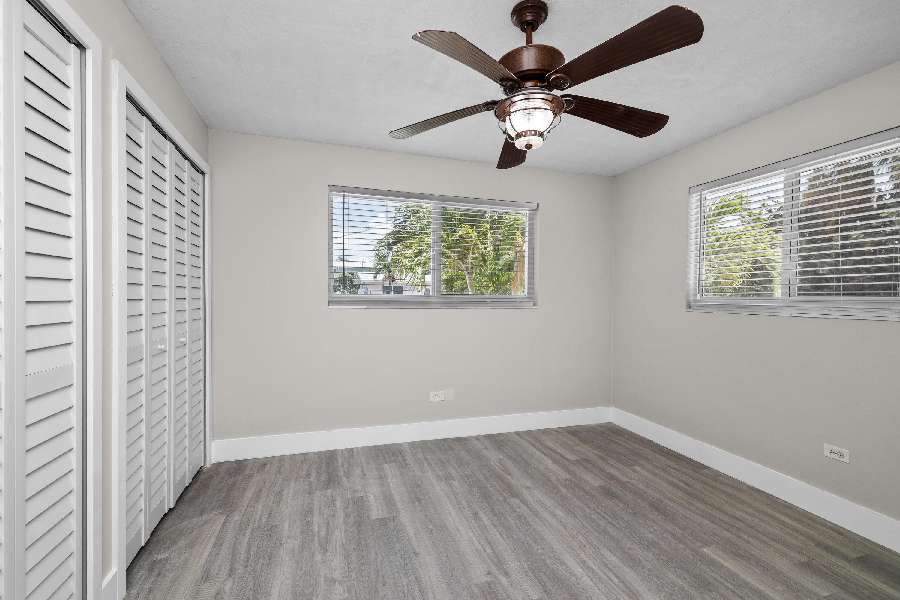 10873 7th Ave Gulf Marathon, FL 33050 - Photo 9 of 25 wooden floor in an empty room with a window