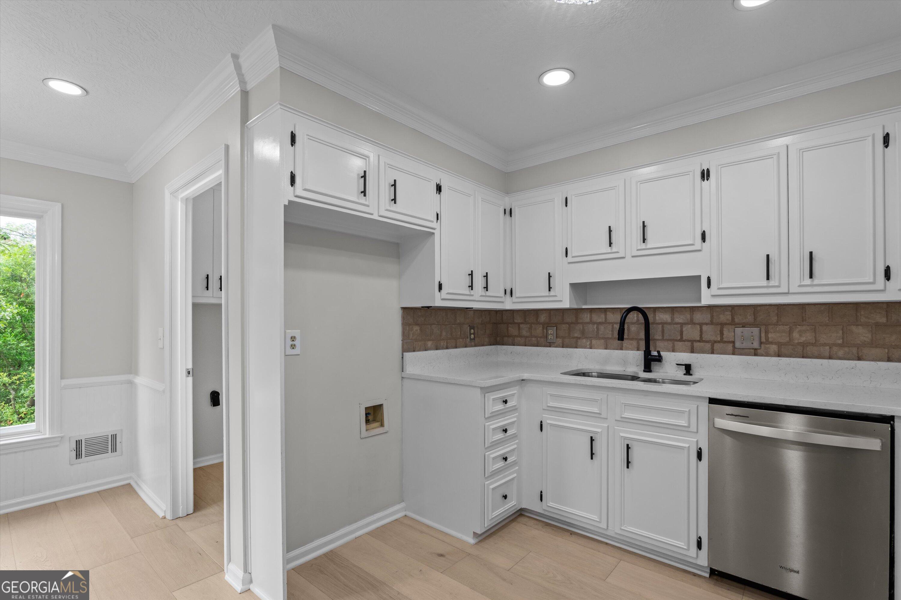 2507 Pinebluff Court Augusta, GA 30909 - Photo 19 of 56 a kitchen with white cabinets and sink