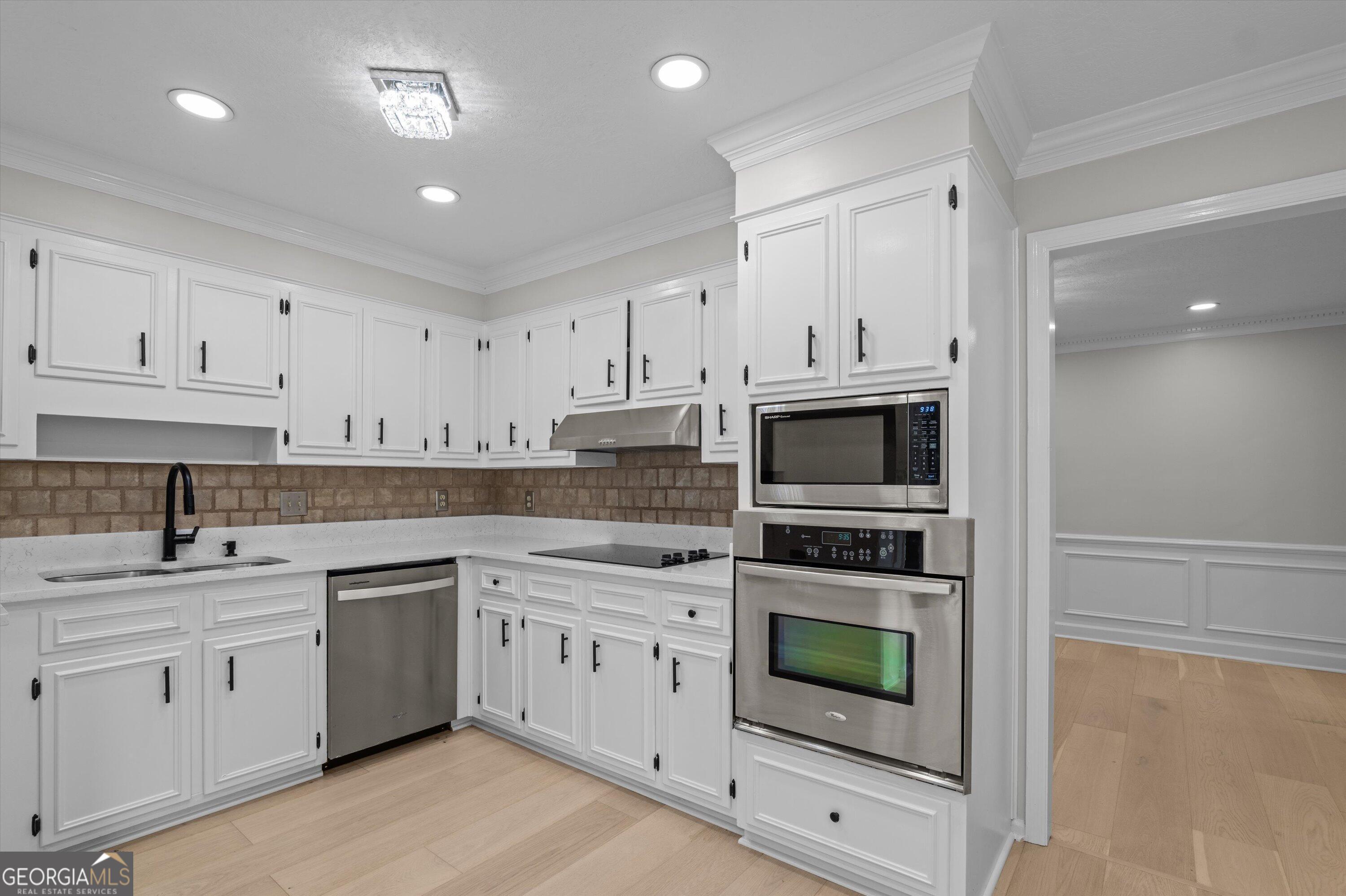 2507 Pinebluff Court Augusta, GA 30909 - Photo 20 of 56 a kitchen with white cabinets and white appliances