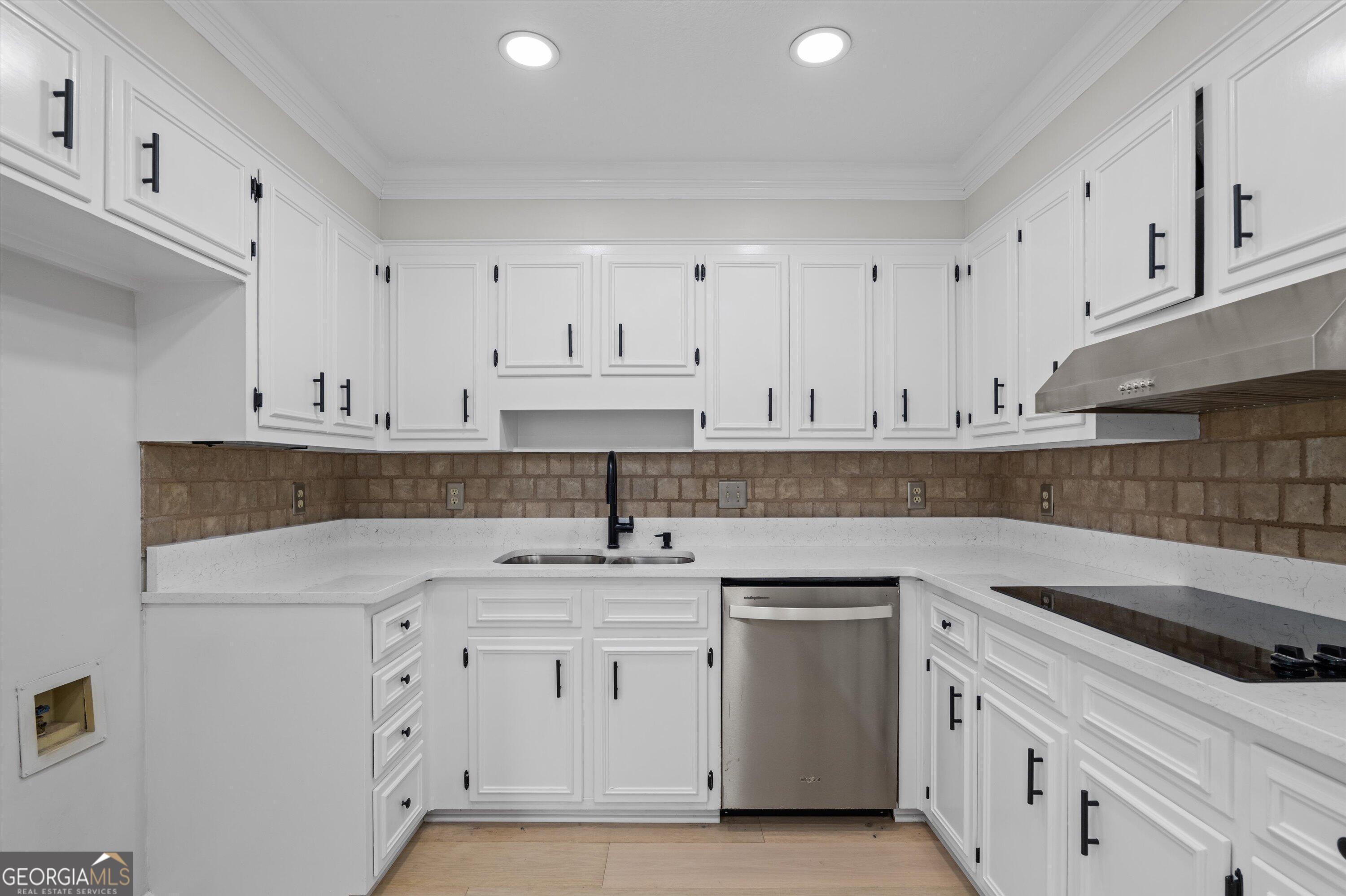 2507 Pinebluff Court Augusta, GA 30909 - Photo 22 of 56 a kitchen with white cabinets stainless steel appliances and sink