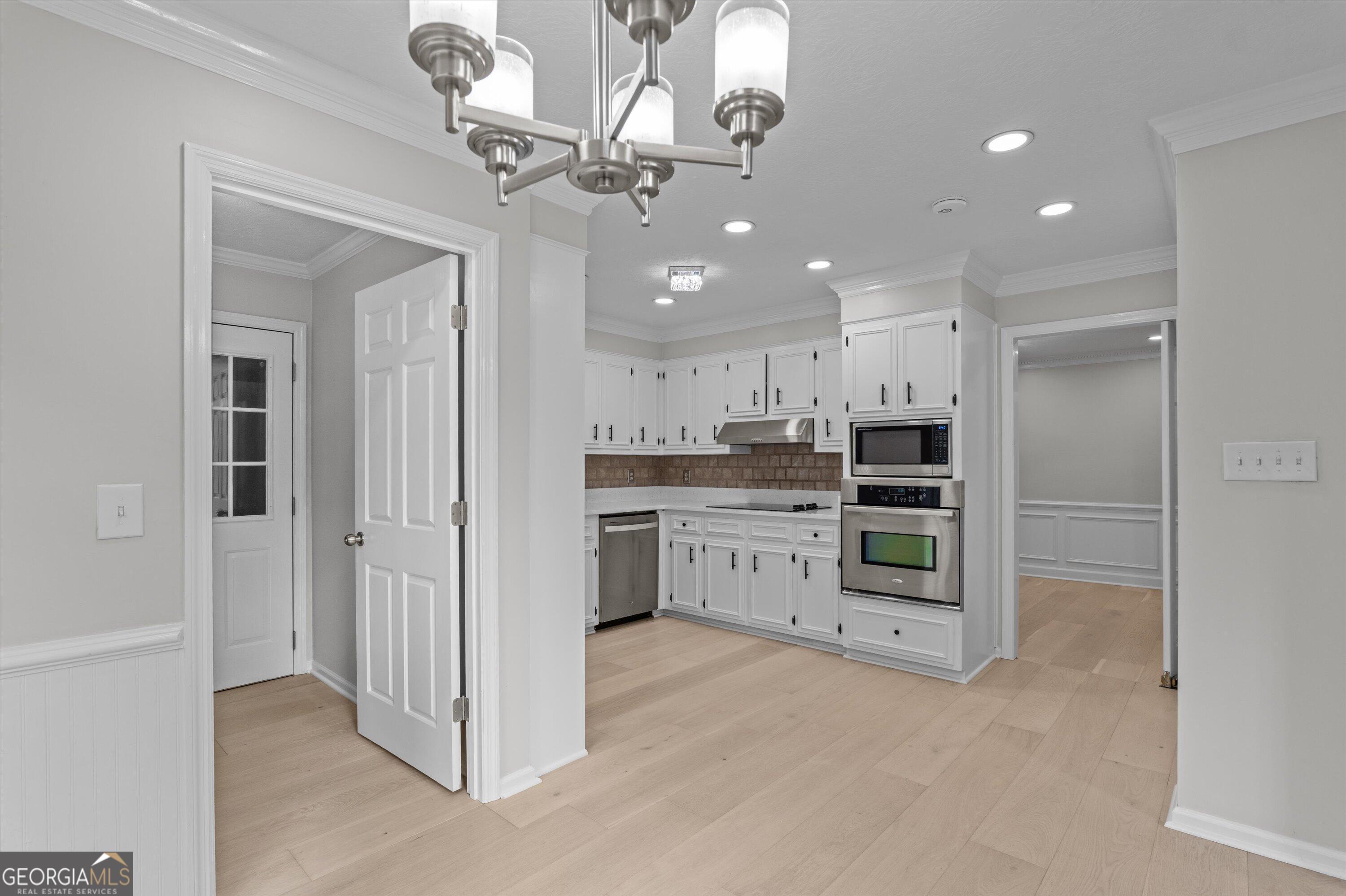 2507 Pinebluff Court Augusta, GA 30909 - Photo 24 of 56 a view of a kitchen with a sink and stainless steel appliances