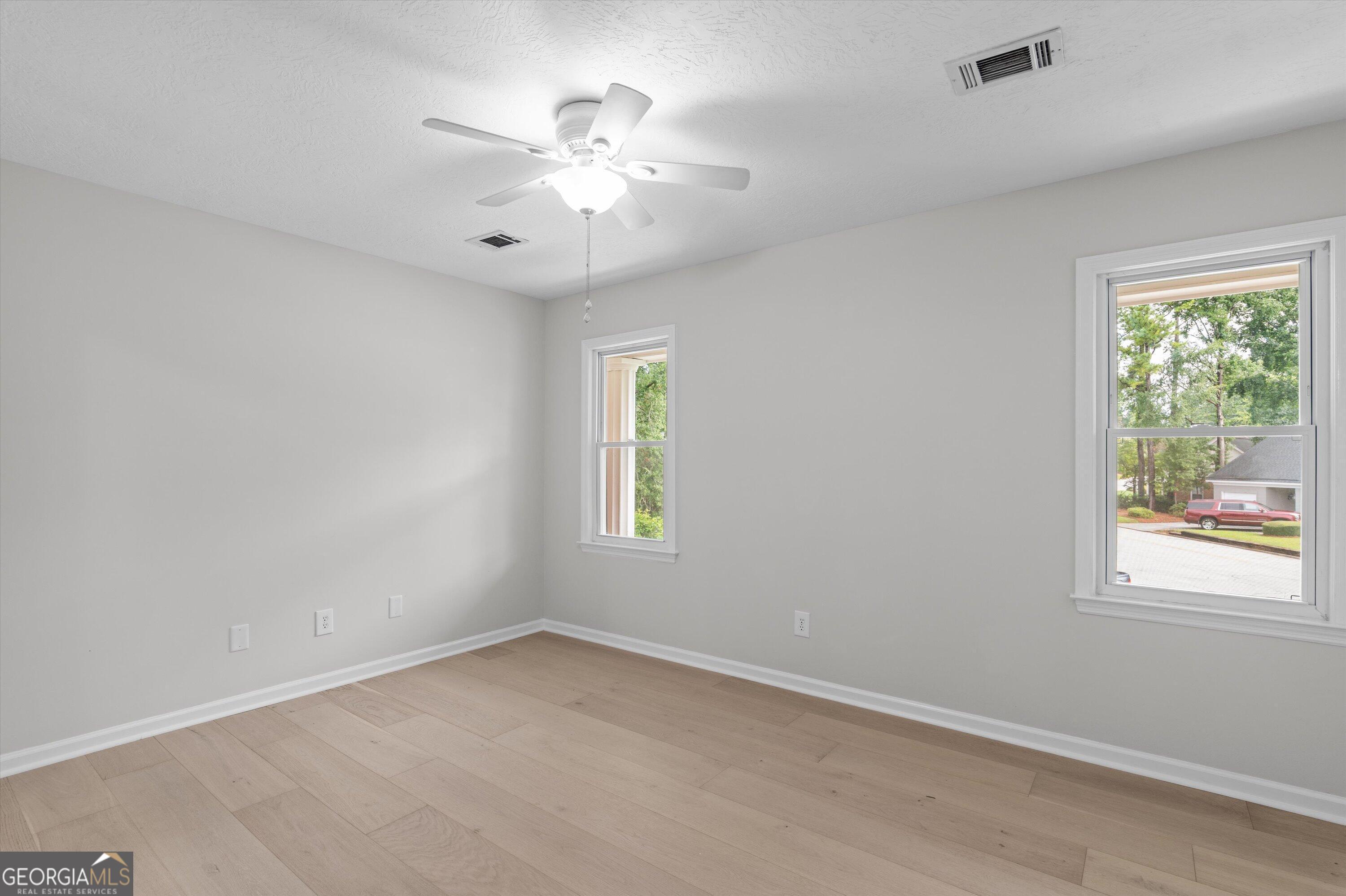 2507 Pinebluff Court Augusta, GA 30909 - Photo 32 of 56 an empty room with windows and fan