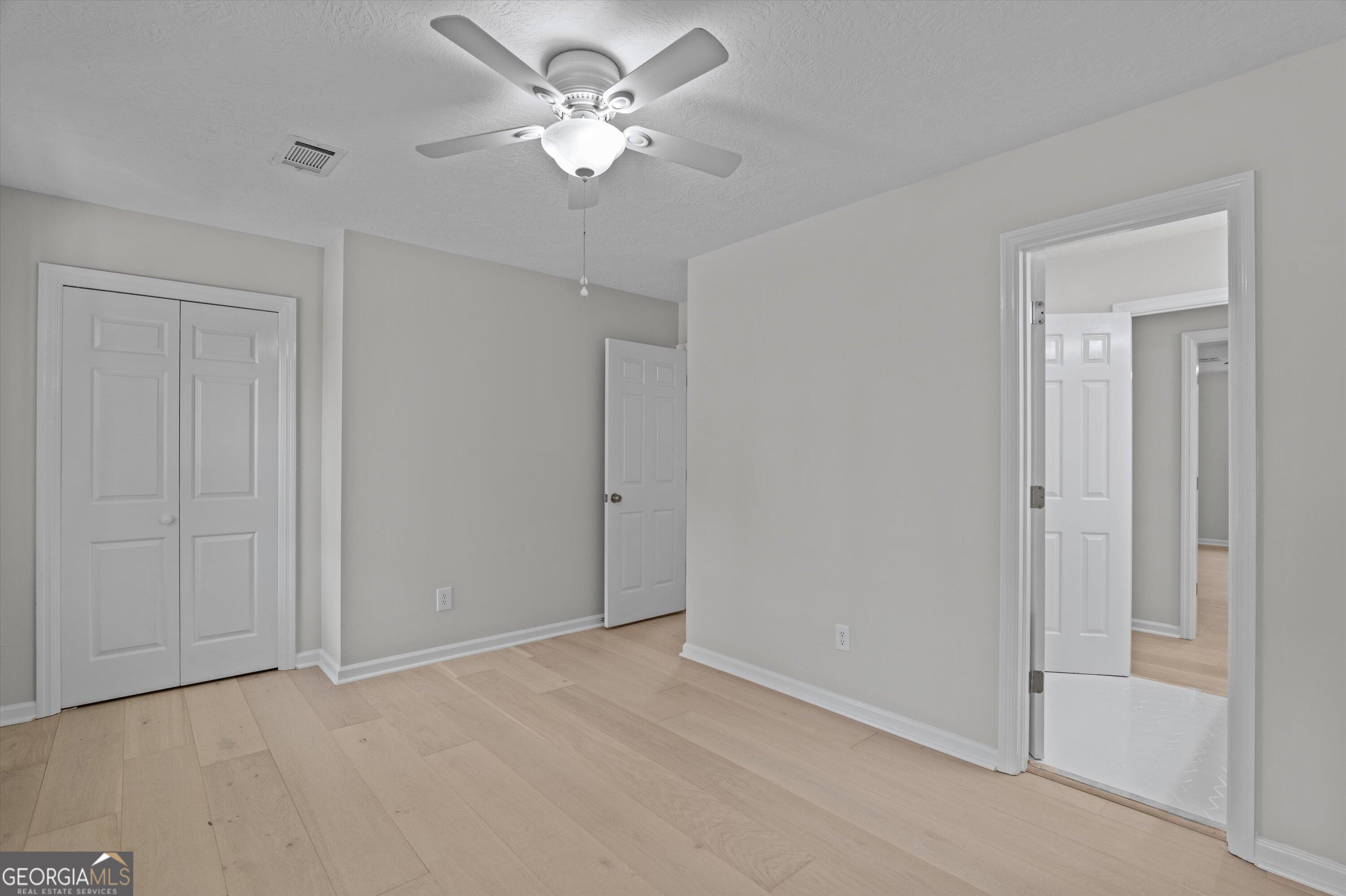 2507 Pinebluff Court Augusta, GA 30909 - Photo 34 of 56 a view of an empty room with a chandelier fan