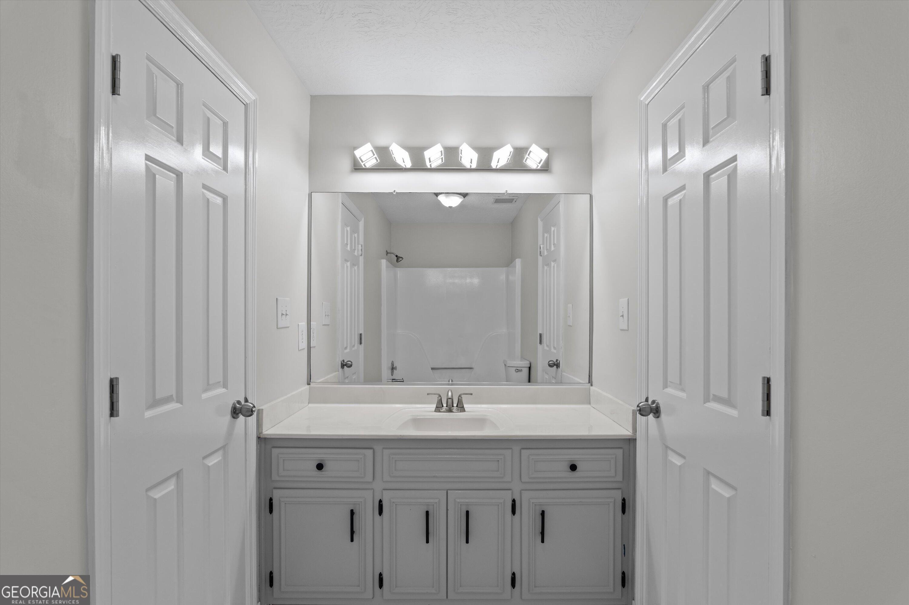 2507 Pinebluff Court Augusta, GA 30909 - Photo 36 of 56 a bathroom with a sink double vanity and a mirror