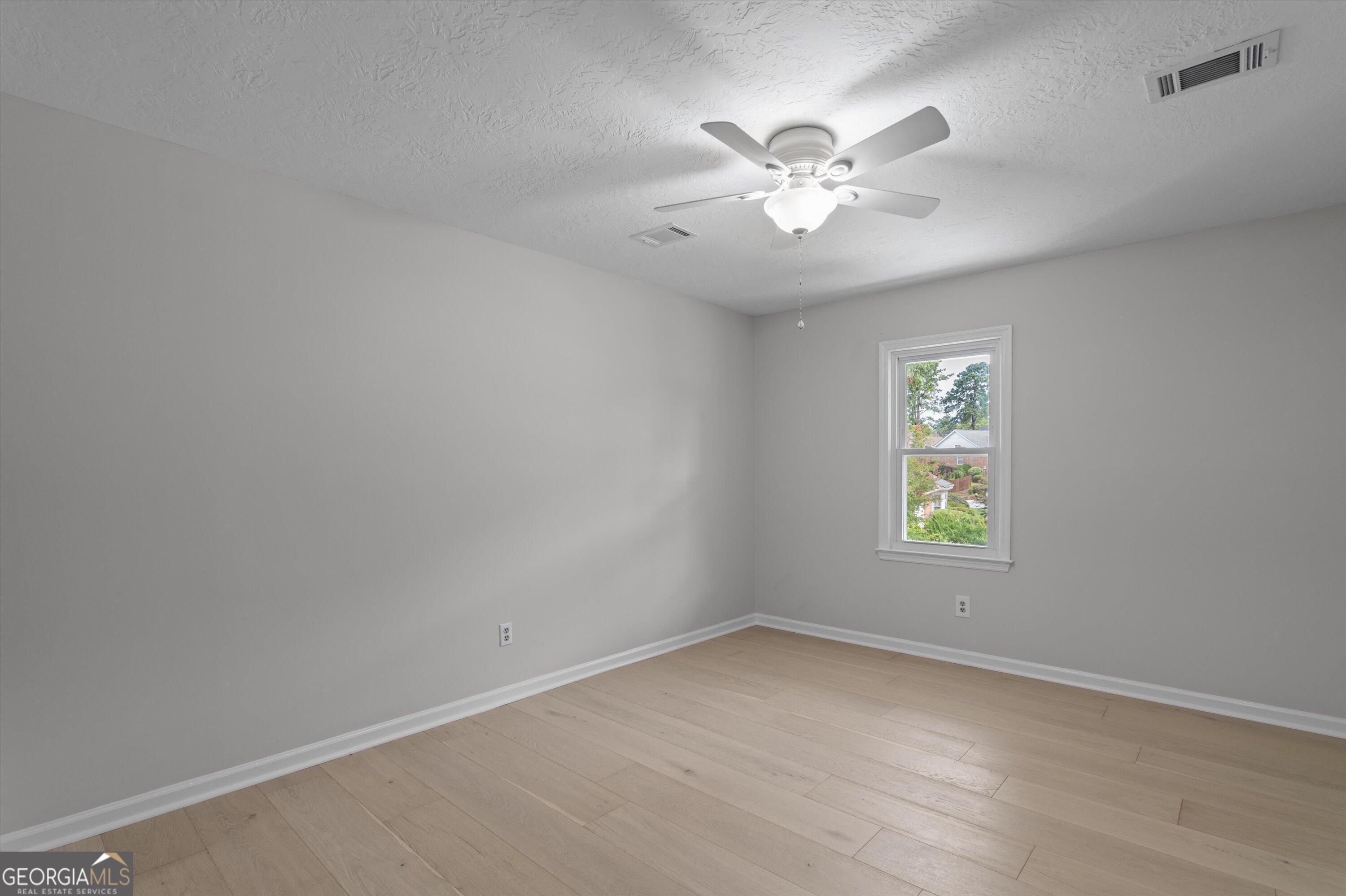 2507 Pinebluff Court Augusta, GA 30909 - Photo 38 of 56 an empty room with windows and fan