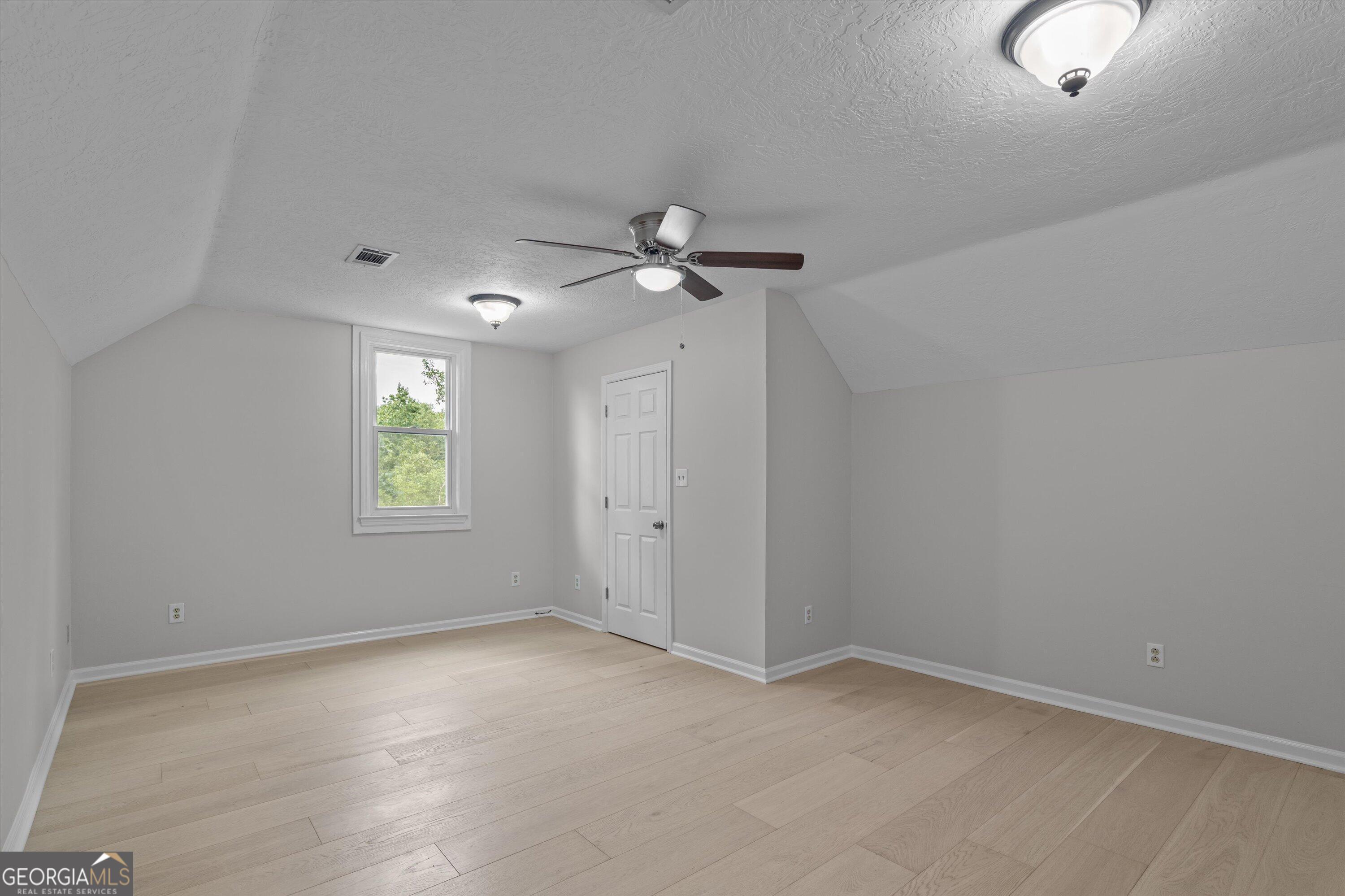 2507 Pinebluff Court Augusta, GA 30909 - Photo 42 of 56 an empty room with a window and a fan