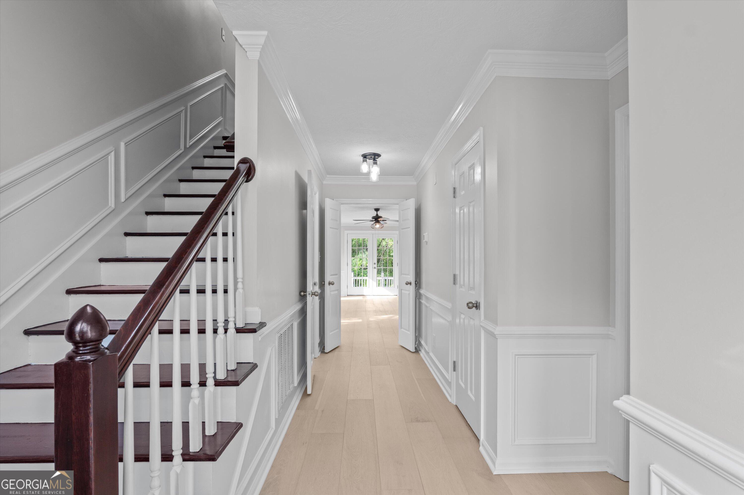 2507 Pinebluff Court Augusta, GA 30909 - Photo 6 of 56 a view of a hallway with wooden floor and stairs