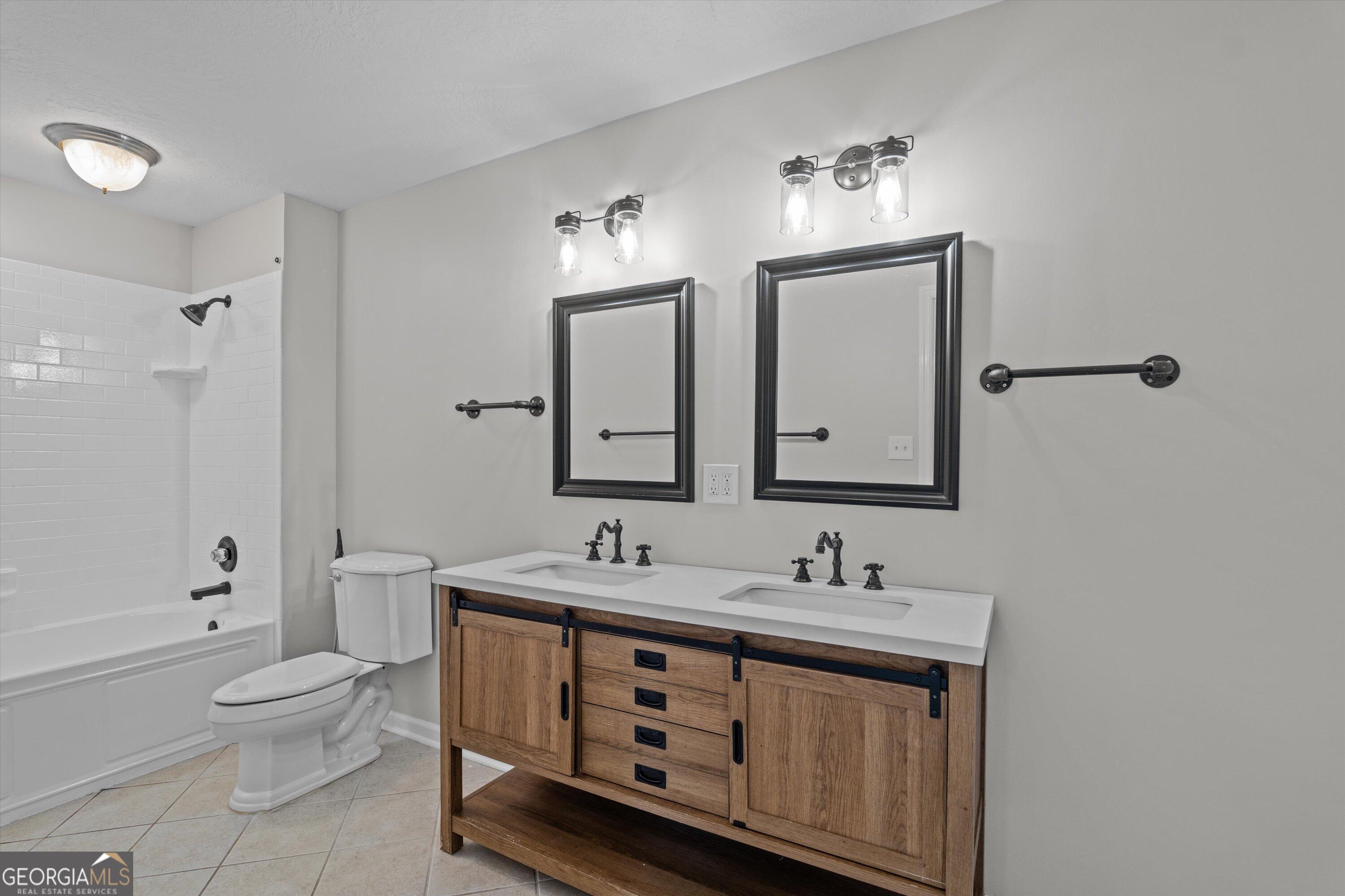 2507 Pinebluff Court Augusta, GA 30909 - Photo 10 of 56 a bathroom with a double vanity sink a toilet and a mirror