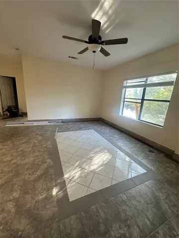 a view of an empty room and window