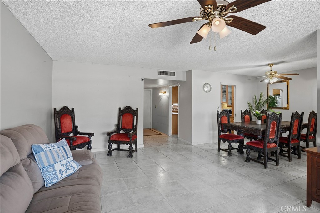 25990 Roanoke Road Menifee, CA 92586 - Photo 13 of 47 a living room with furniture and a chandelier