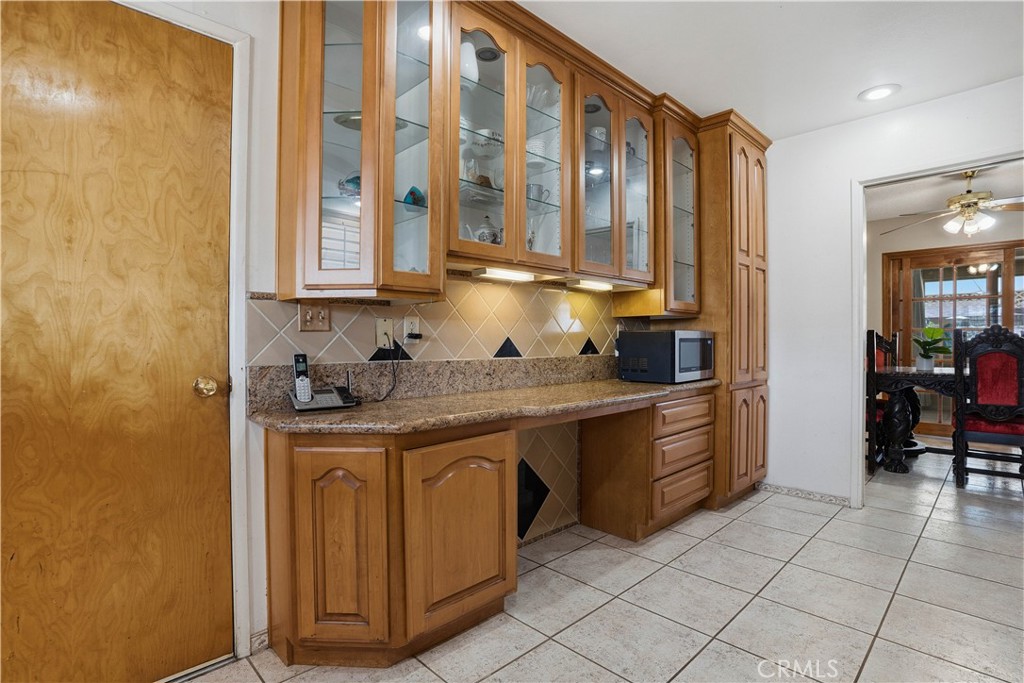 25990 Roanoke Road Menifee, CA 92586 - Photo 16 of 47 a kitchen with stainless steel appliances granite countertop a sink and cabinets