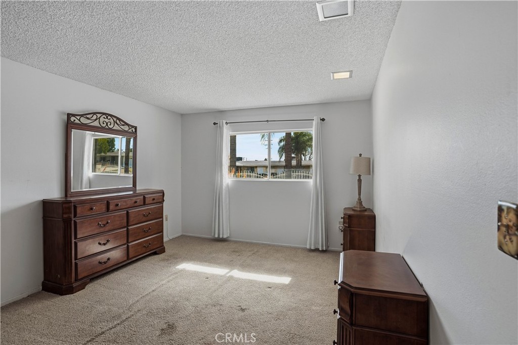 25990 Roanoke Road Menifee, CA 92586 - Photo 21 of 47 a room with furniture and window