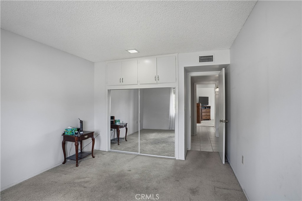 25990 Roanoke Road Menifee, CA 92586 - Photo 24 of 47 a view of livingroom with kitchen and dining room