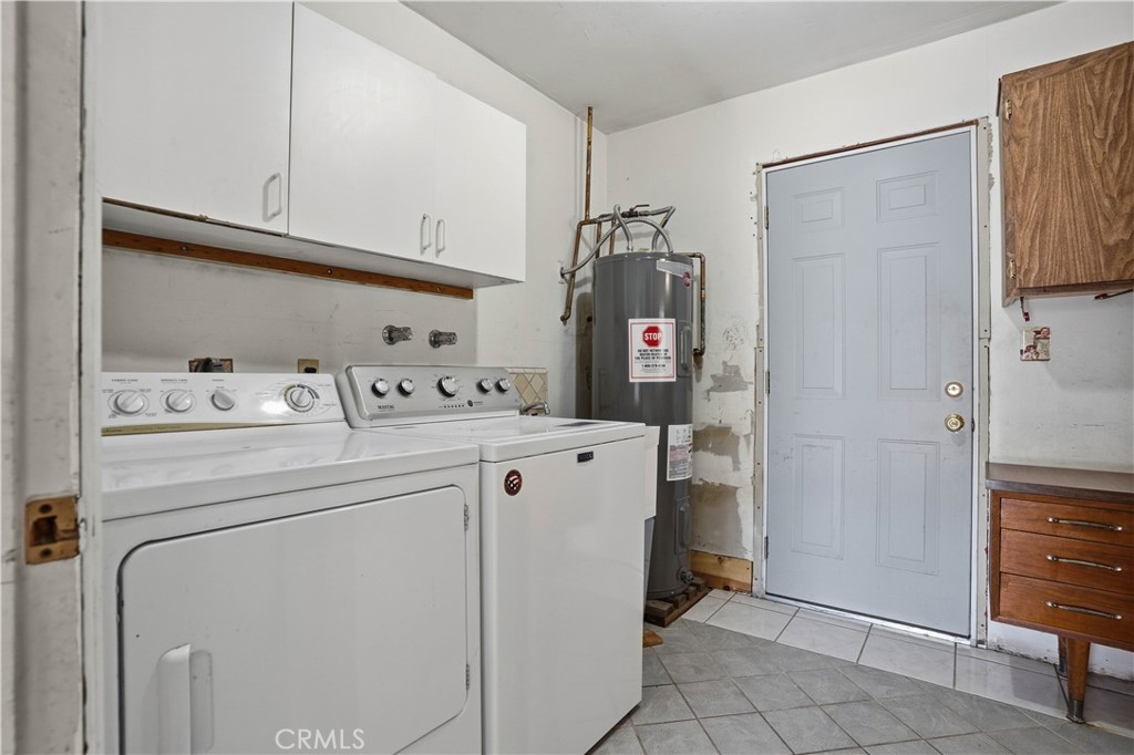 25990 Roanoke Road Menifee, CA 92586 - Photo 30 of 47 a utility room with cabinets washer and dryer