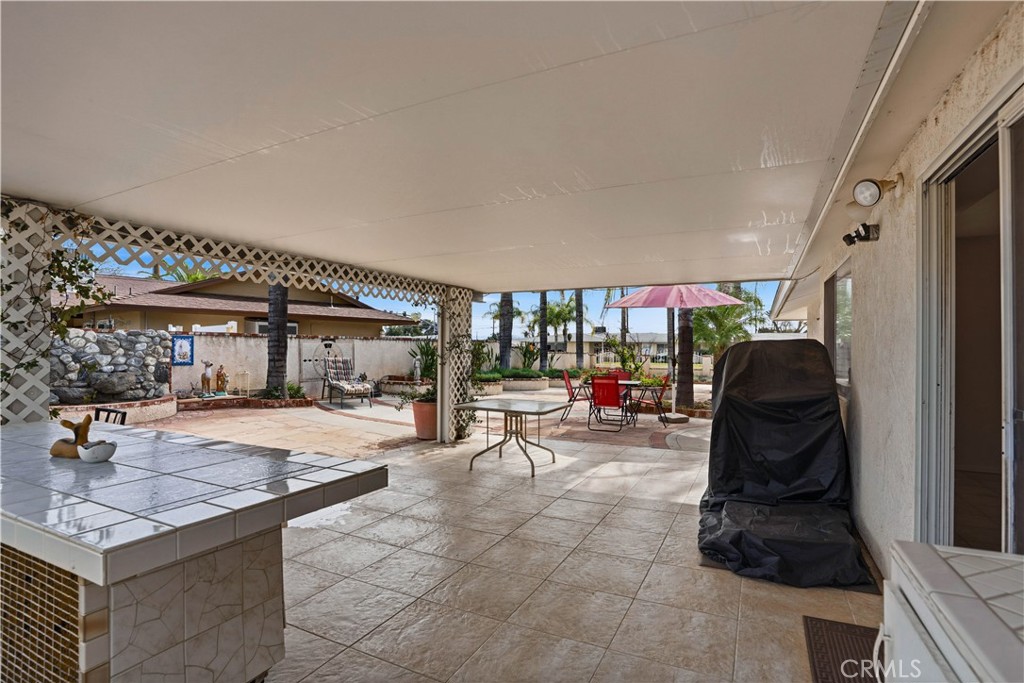 25990 Roanoke Road Menifee, CA 92586 - Photo 33 of 47 a living room with furniture a flat screen tv and floor to ceiling window