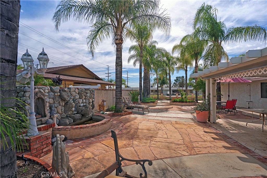 25990 Roanoke Road Menifee, CA 92586 - Photo 36 of 47 a row of palm trees in front of a building