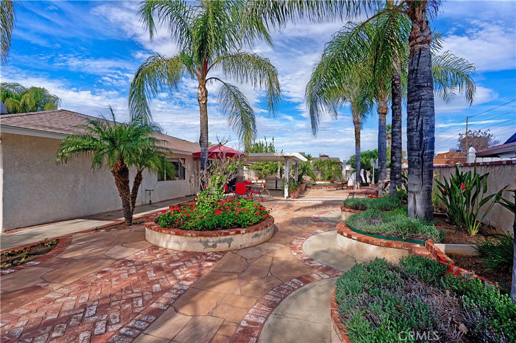 25990 Roanoke Road Menifee, CA 92586 - Photo 39 of 47 a front view of a house with a garden